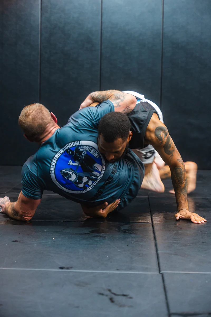 Adult students training Brazilian Jiu Jitsu at Speak Easy